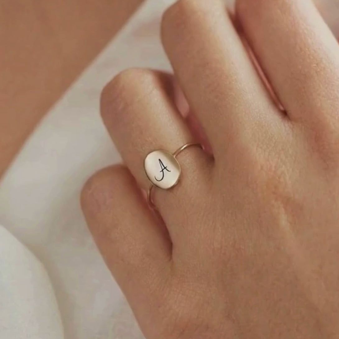 Video showing a model in a casual stylish outfit wearing the custom signet ring.