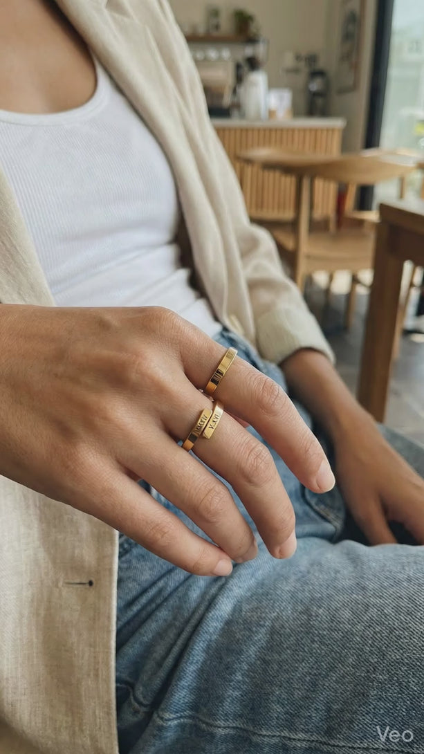 Model holding a warm cup of tea, subtly displaying her personalized delicate 2mm stainless steel open ring in everyday life.