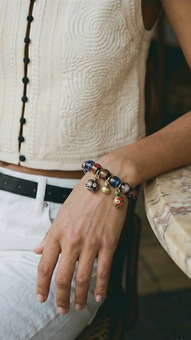 Video showing the light-catching textures of Incense Ash Liuli beads and the intricate details of the Gold-Swallowing Beast charms in motion.